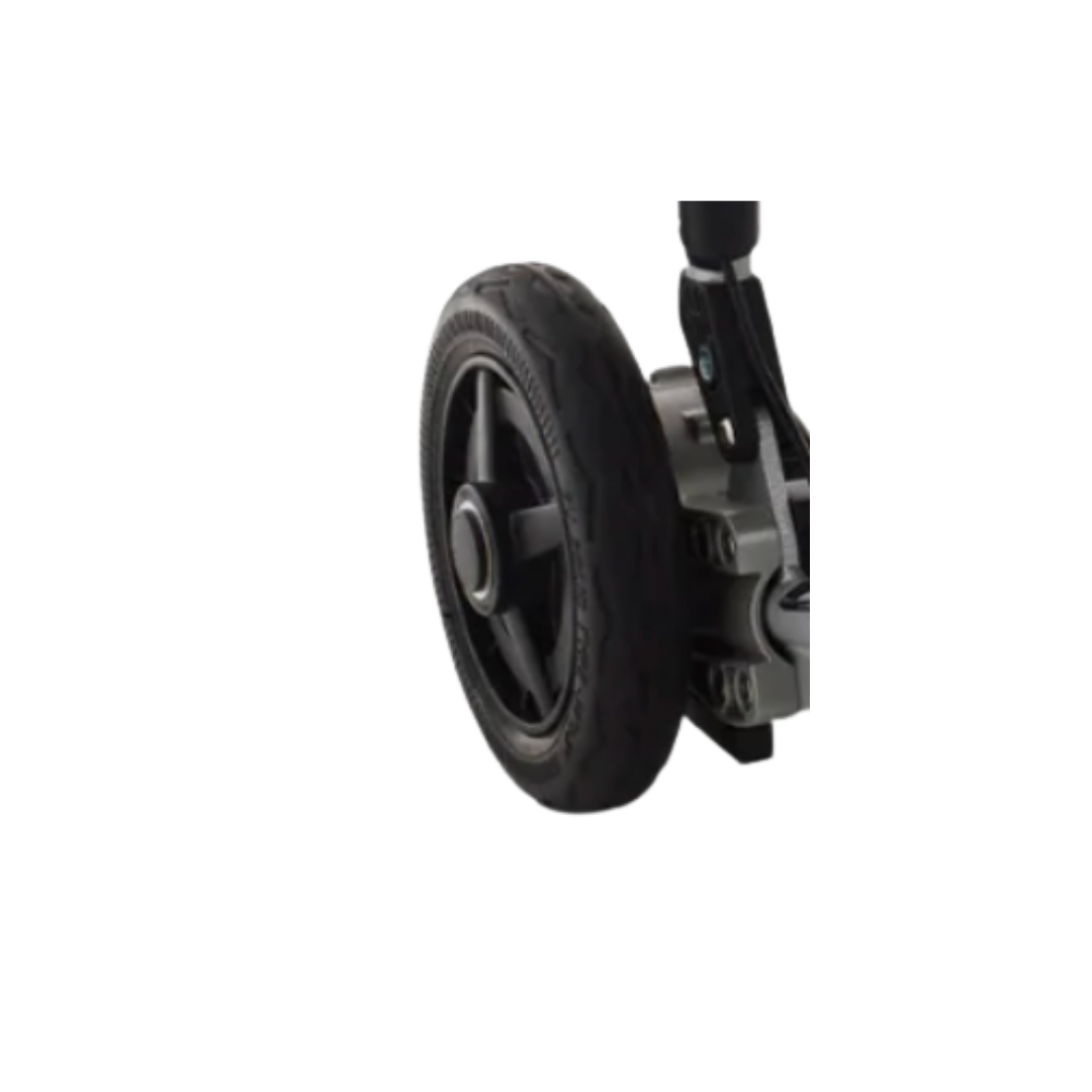 Close-up of a black rubber wheel attached to the frame of a Journey Zoomer Powerchair, showing part of the suspension and axle mechanism next to a Wheel Extractor for easy removal and maintenance.